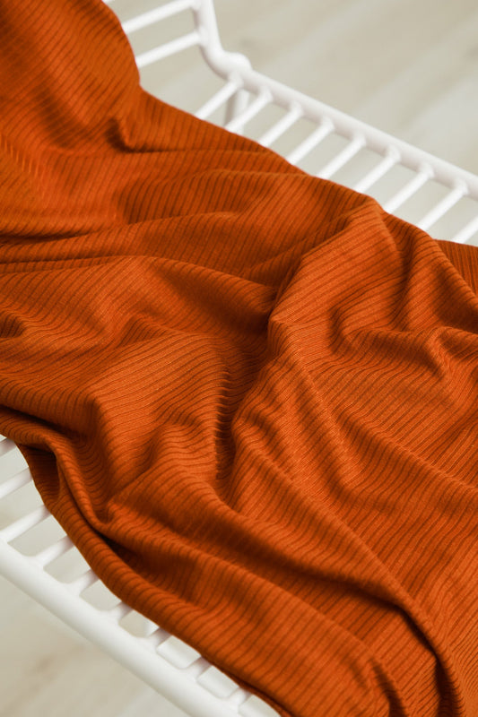 Rhythmic Rib modal jersey in Spice, a rust ribbed knit fabric by the half yard