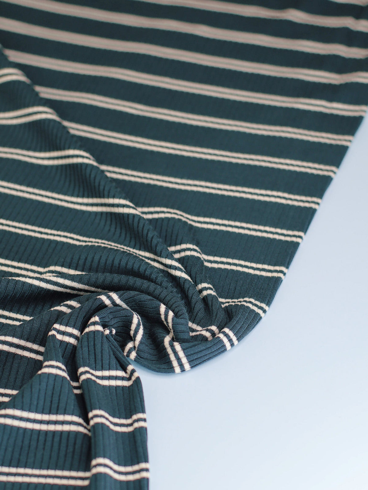 meetMILK Derby Slim Stripe modal jersey in Pond, dark green and cream striped knit fabric