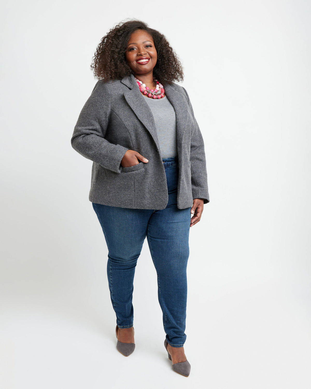 Cashmerette Auburn Blazer PDF sewing pattern, woman wearing a gray blazer, white shirt, and blue jeans