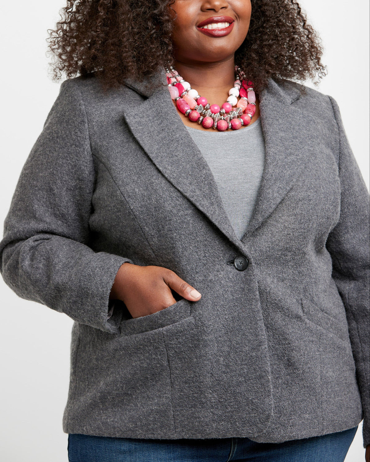 Cashmerette Auburn Blazer PDF sewing pattern, woman wearing a gray blazer over a gray top with a pink necklace
