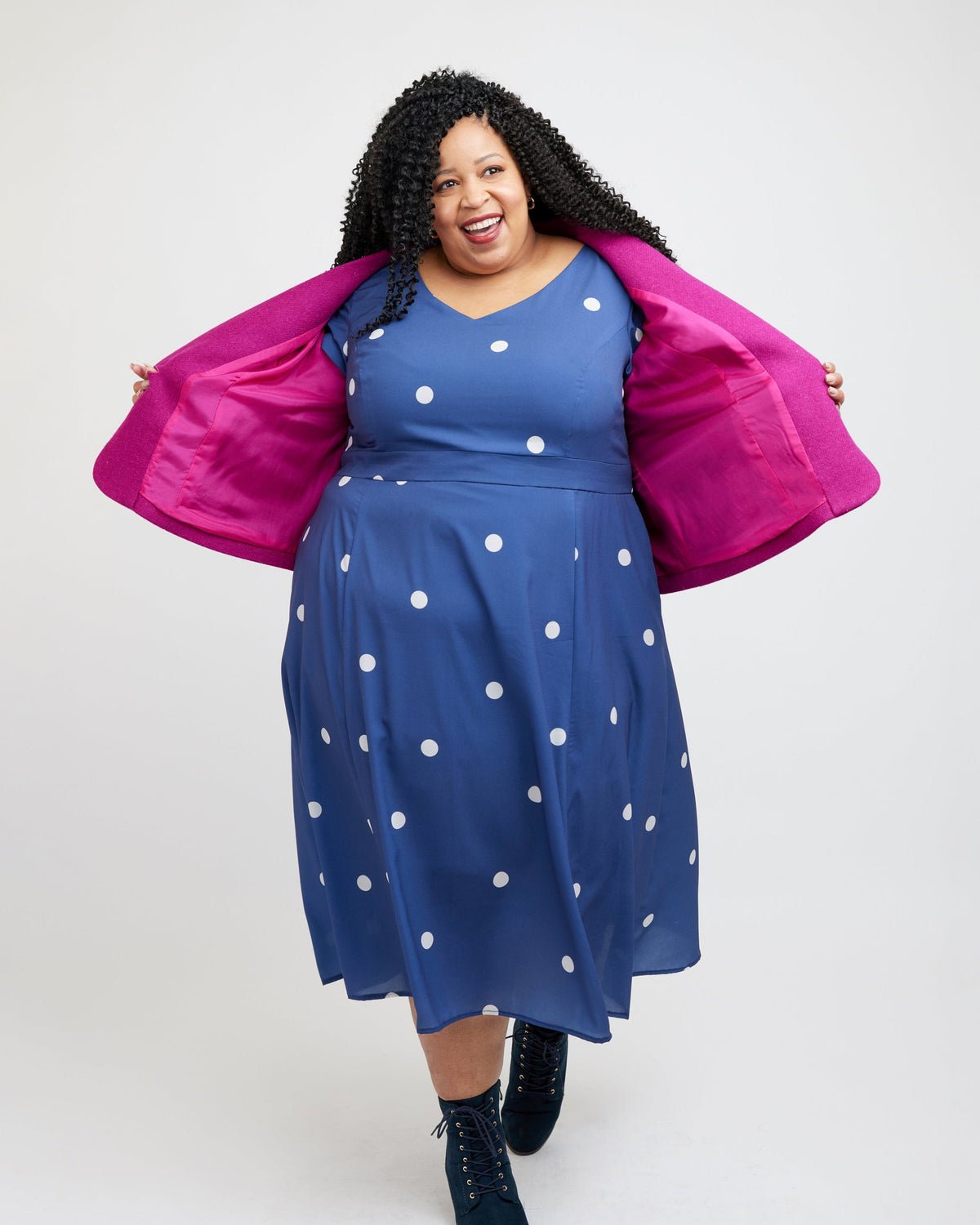 Cashmerette Auburn Blazer PDF sewing pattern, woman wearing a blue dress with white polka dots and a pink jacket