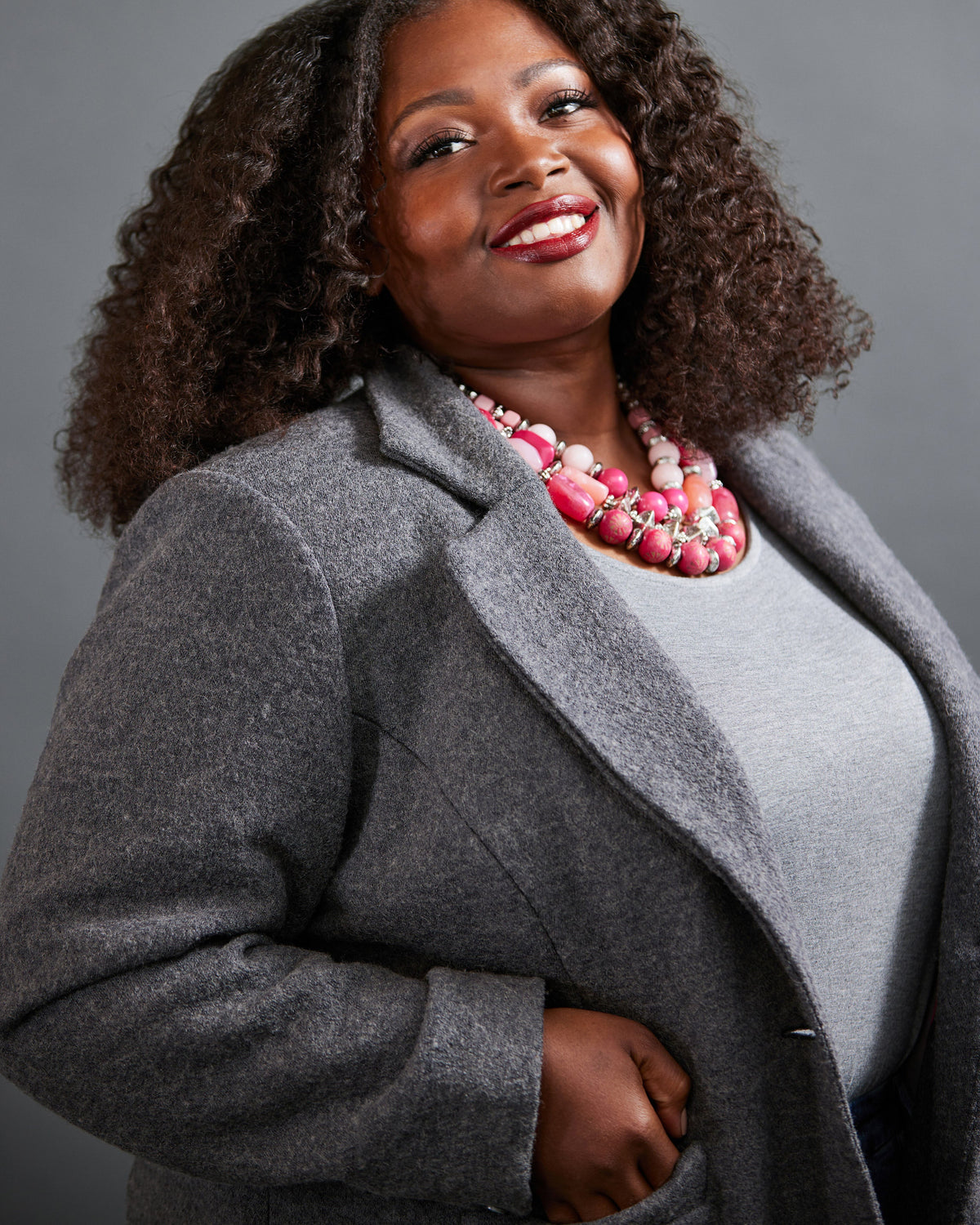 Cashmerette Auburn Blazer PDF sewing pattern, woman wearing a gray coat and pink necklace