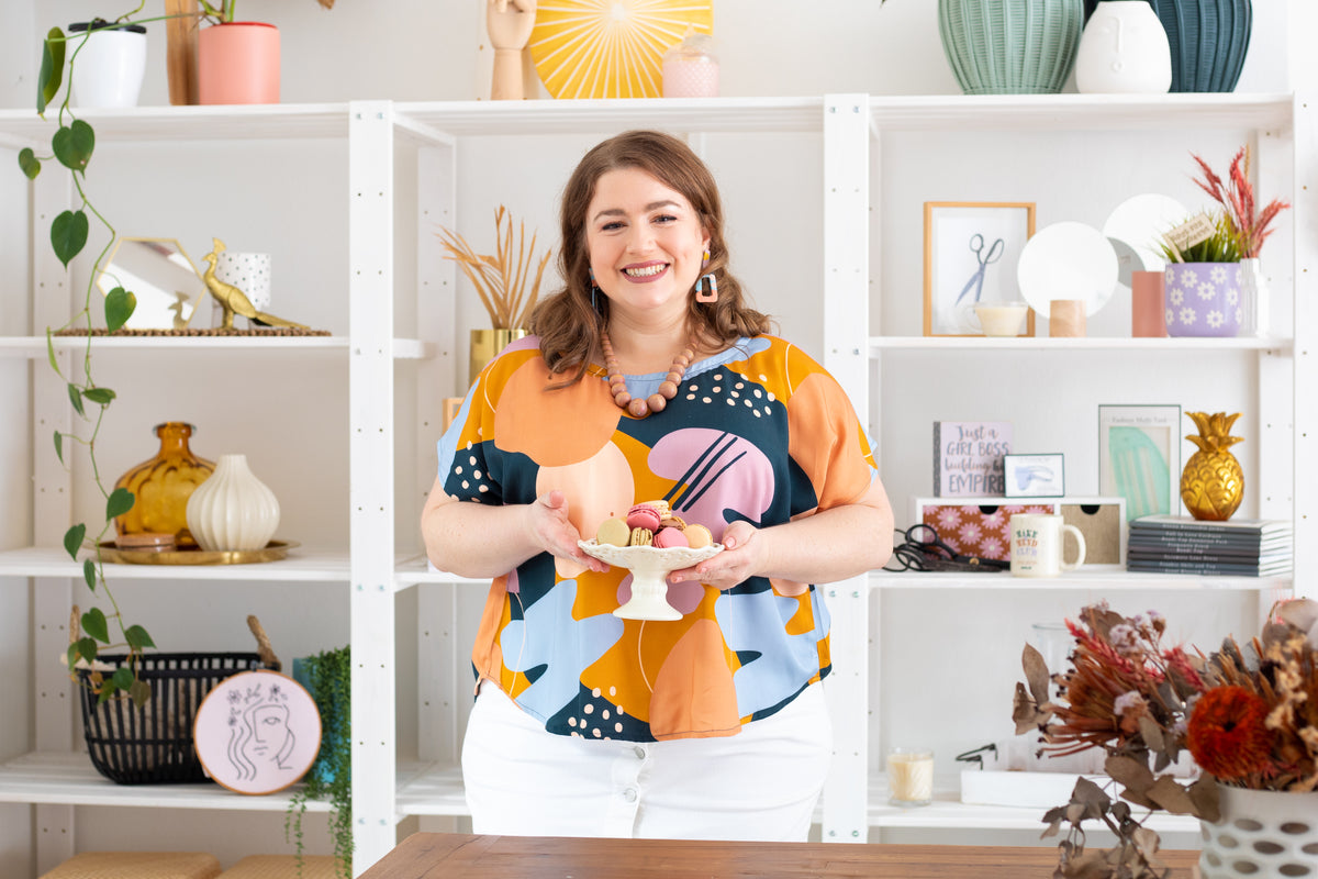 Sew to Grow Bondi Top PDF sewing pattern, model with plants in a print top