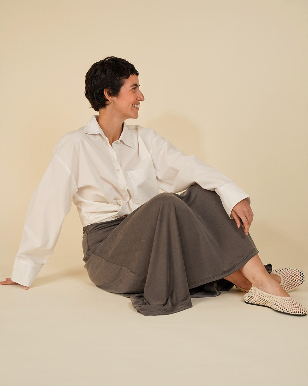 Wardrobe By Me Boxy Shirt PDF sewing pattern, seated in a cream shirt