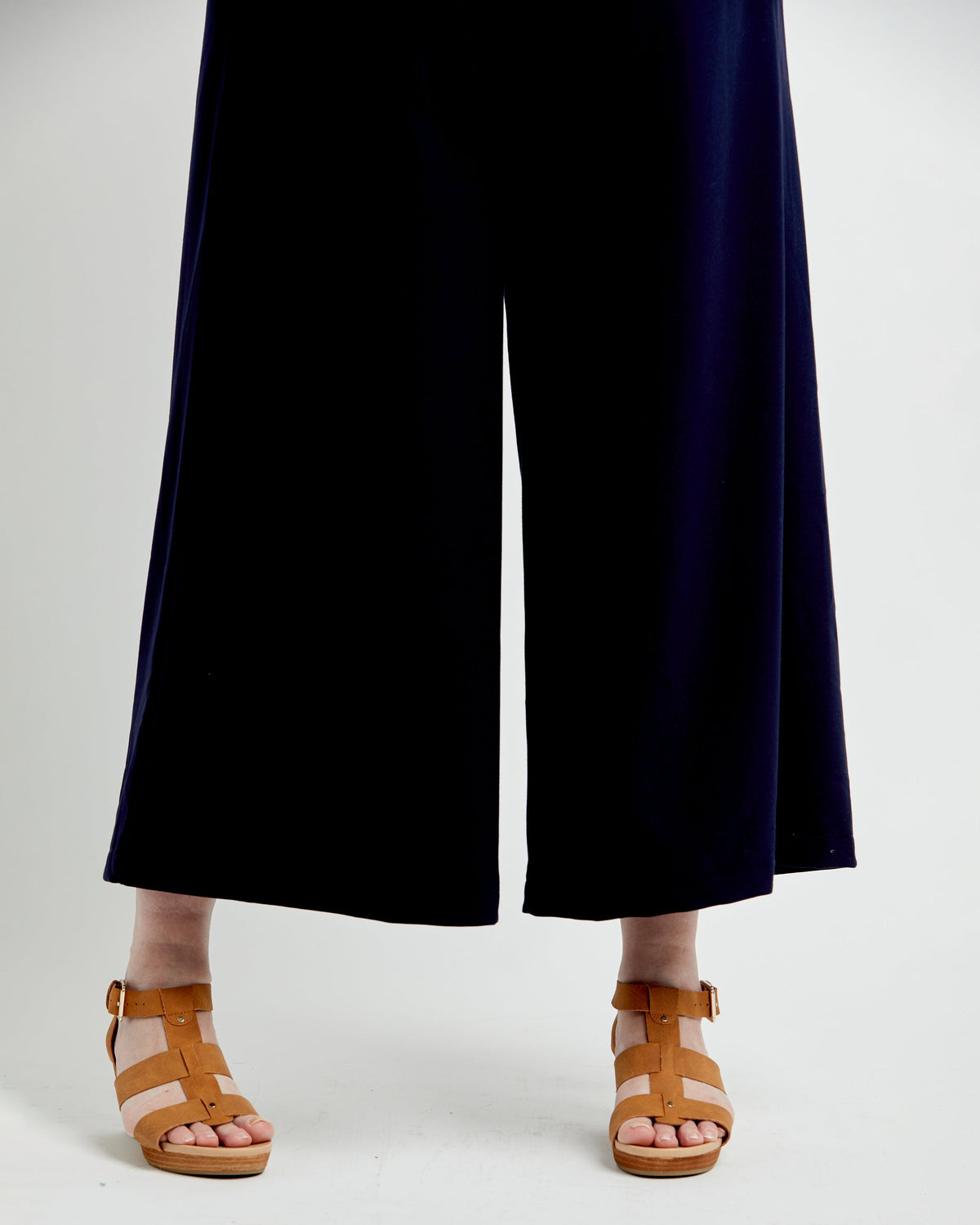 Cashmerette Calder Pants and Shorts PDF sewing pattern, person wearing navy blue pants and brown sandals