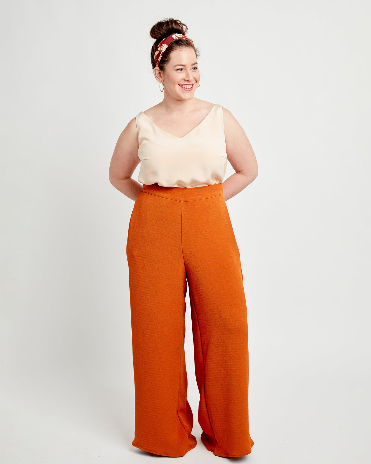 Cashmerette Calder Pants and Shorts PDF sewing pattern, woman wearing a beige top and orange pants