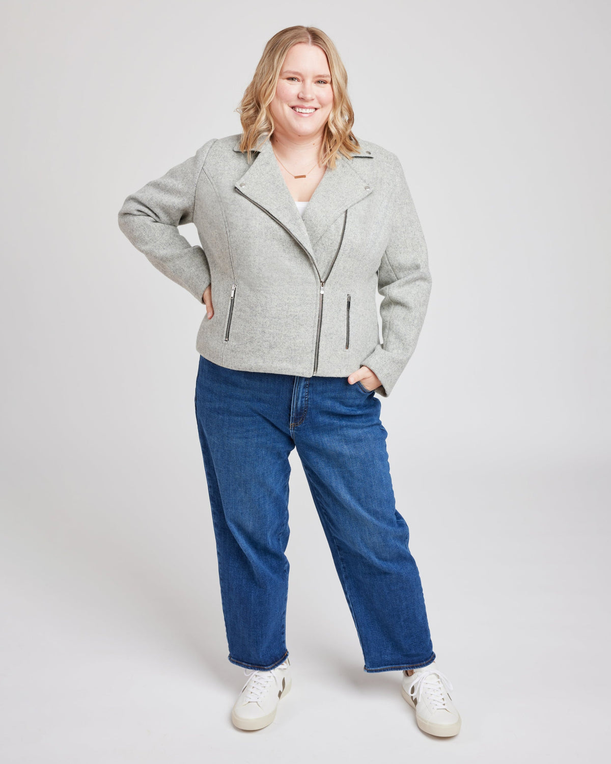Cashmerette Canton Moto Jacket PDF sewing pattern, woman wearing a gray jacket and blue jeans
