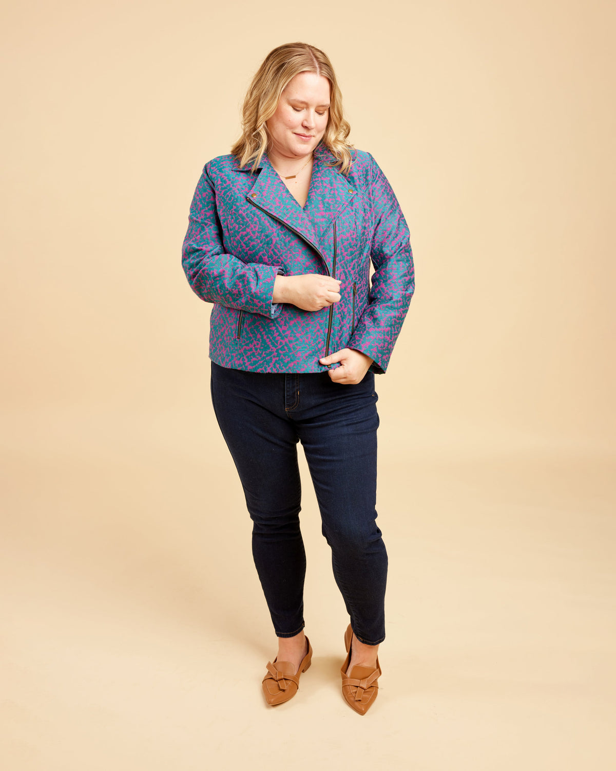 Cashmerette Canton Moto Jacket PDF sewing pattern, woman wearing a blue patterned jacket and dark jeans
