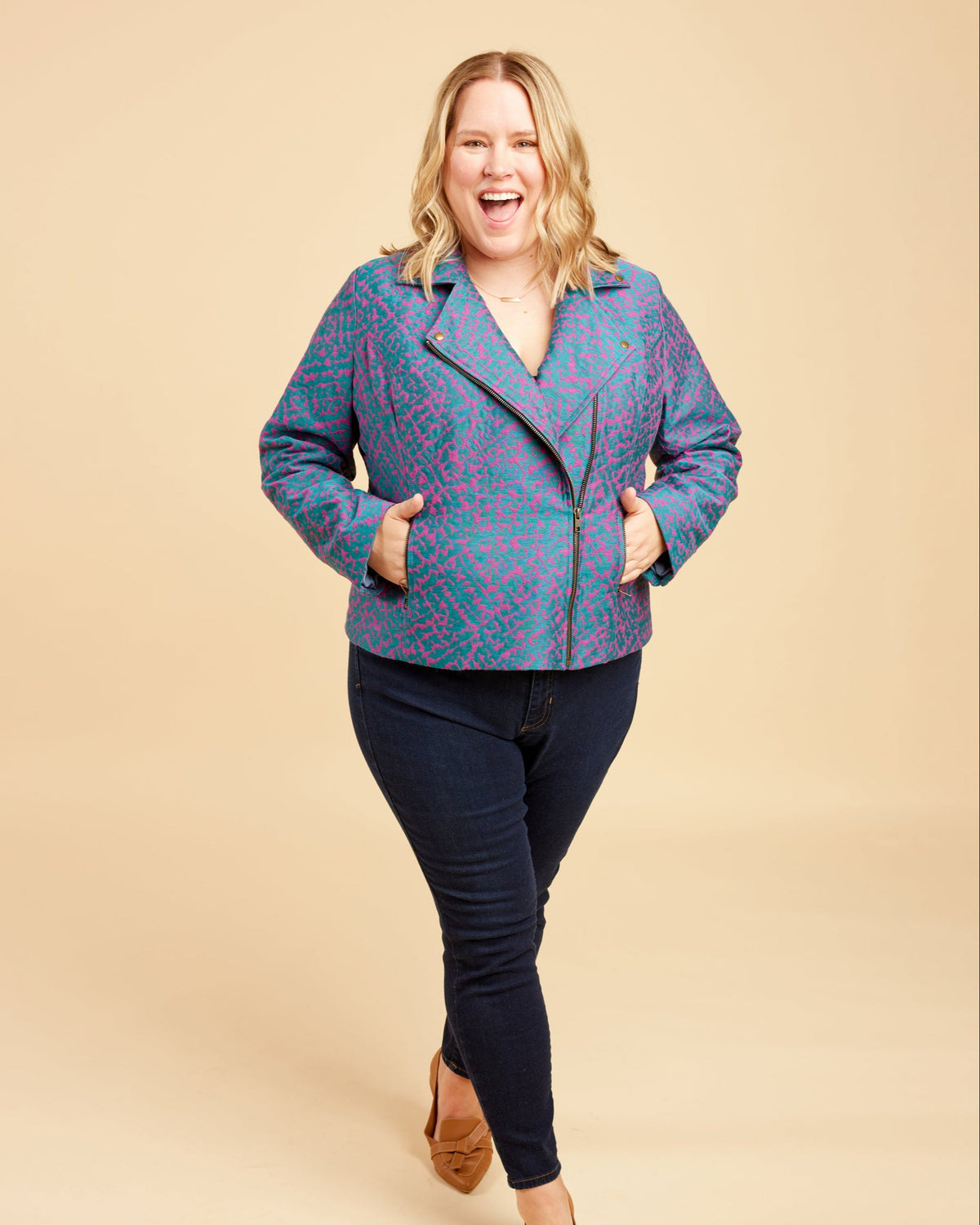 Cashmerette Canton Moto Jacket PDF sewing pattern, woman wearing a blue patterned jacket and black pants