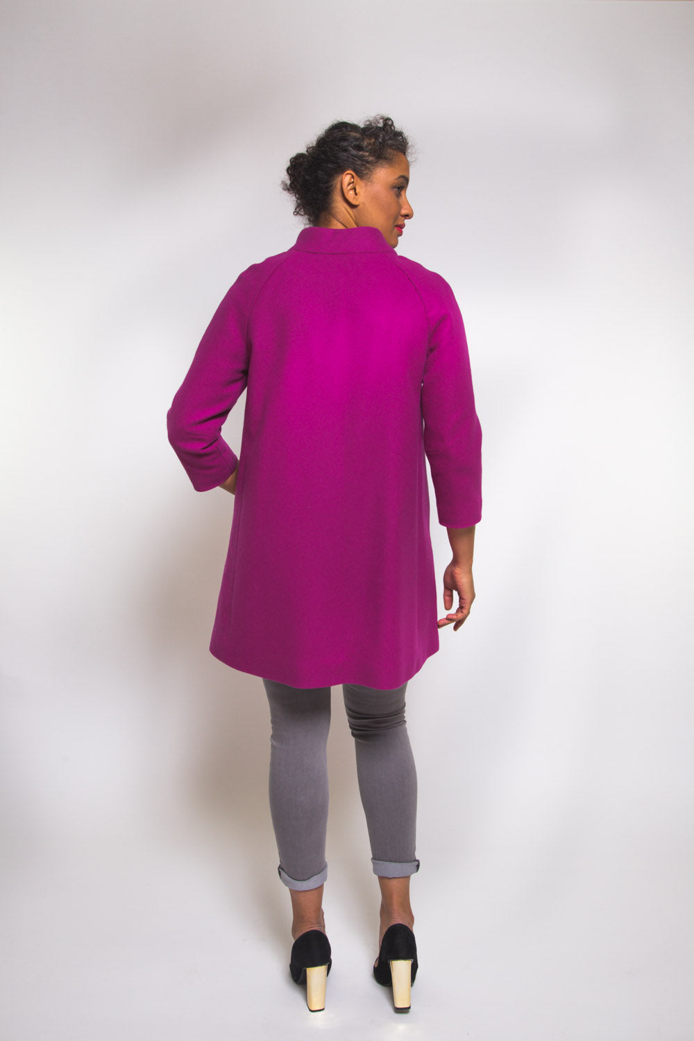 Three quarter view of a magenta coat sewn with the Closet Core Clare Coat sewing pattern