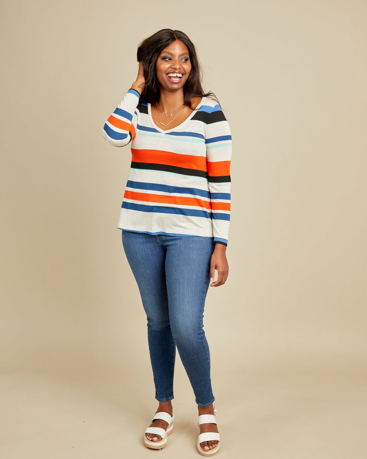 Cashmerette Concord T-Shirt PDF sewing pattern, woman wearing a striped sweater and blue jeans