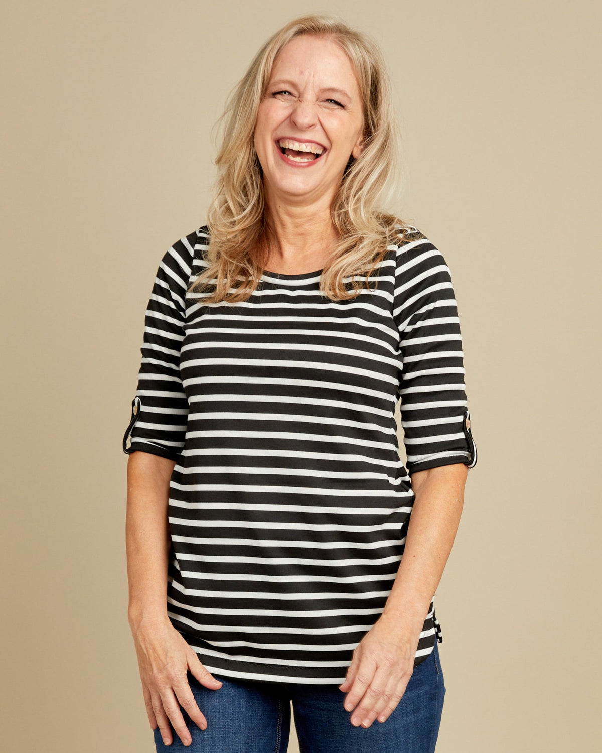 Cashmerette Concord T-Shirt PDF sewing pattern, woman wearing a black and white striped shirt and blue jeans