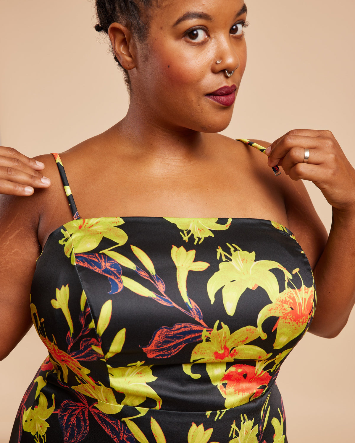 Cashmerette Ellington Dress PDF sewing pattern, woman wearing a black dress with colorful floral patterns