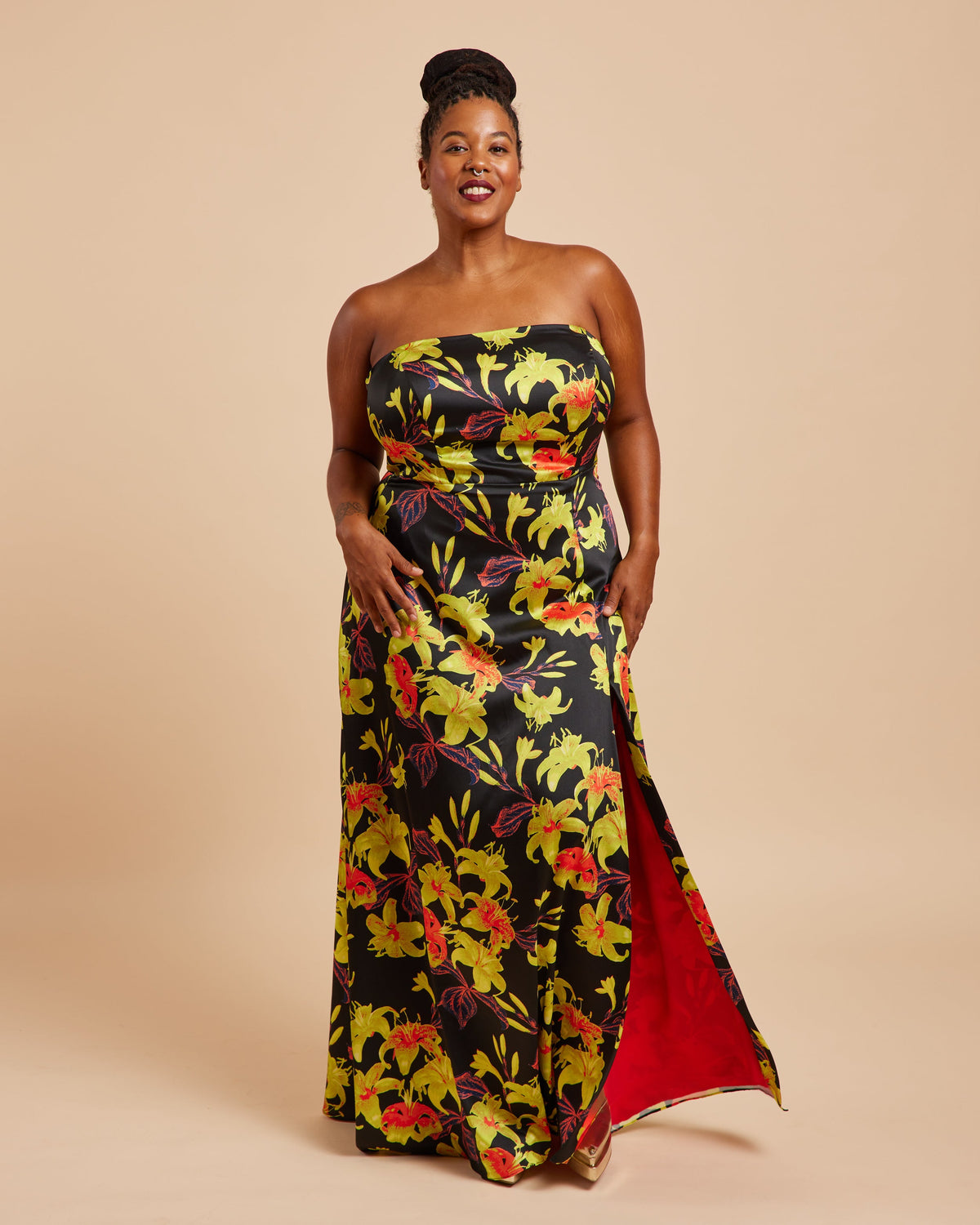 Cashmerette Ellington Dress PDF sewing pattern, woman wearing a strapless floral dress with a red lining