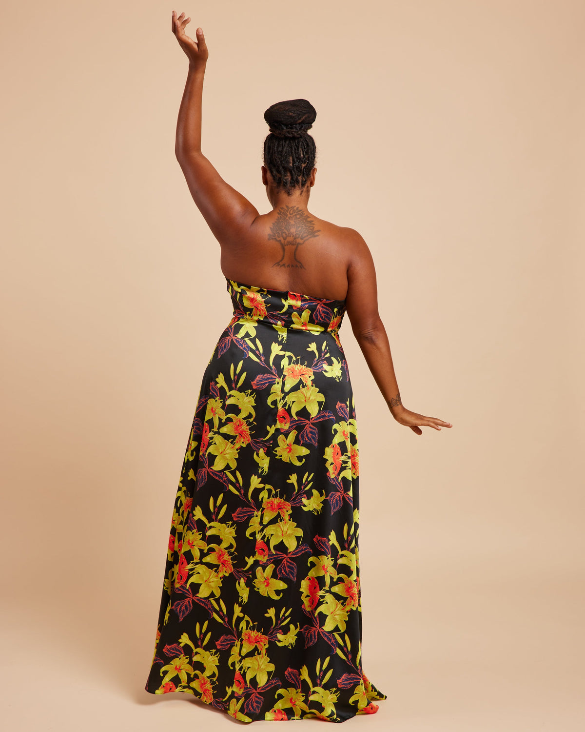 Cashmerette Ellington Dress PDF sewing pattern, woman wearing a strapless floral dress, arms raised