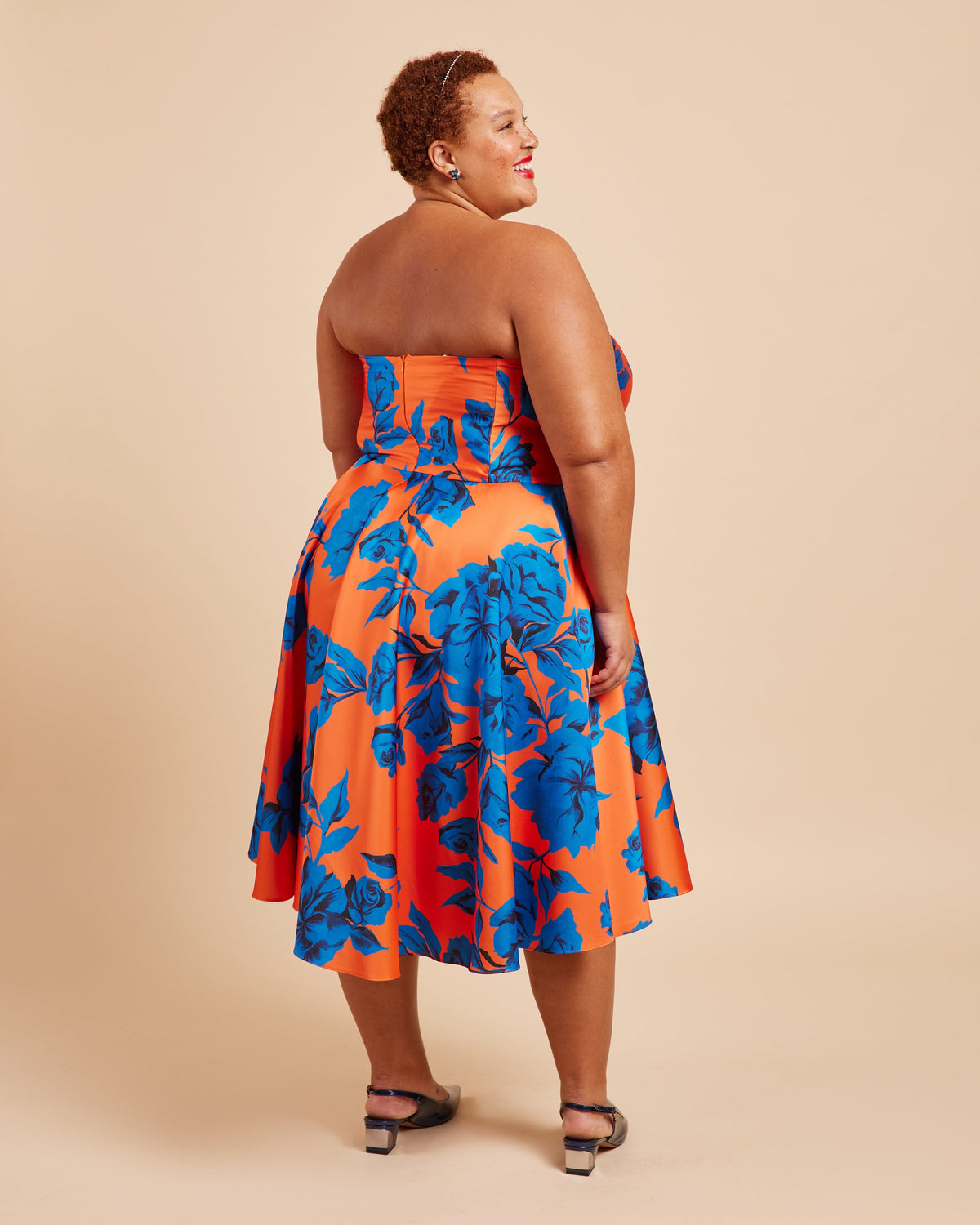 Cashmerette Ellington Dress PDF sewing pattern, woman wearing a strapless dress with blue and orange floral pattern