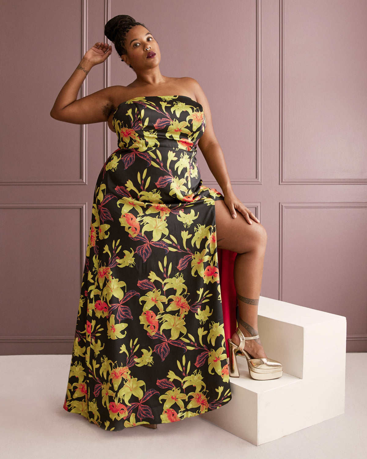 Cashmerette Ellington Dress PDF sewing pattern, woman wearing a floral strapless dress against a pink paneled wall