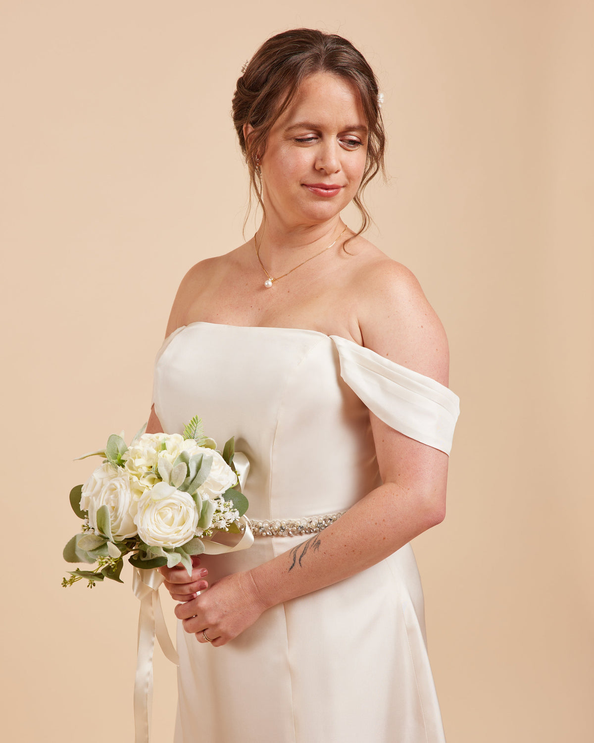 Cashmerette Ellington Dress PDF sewing pattern, woman in a white off-shoulder dress holding a bouquet