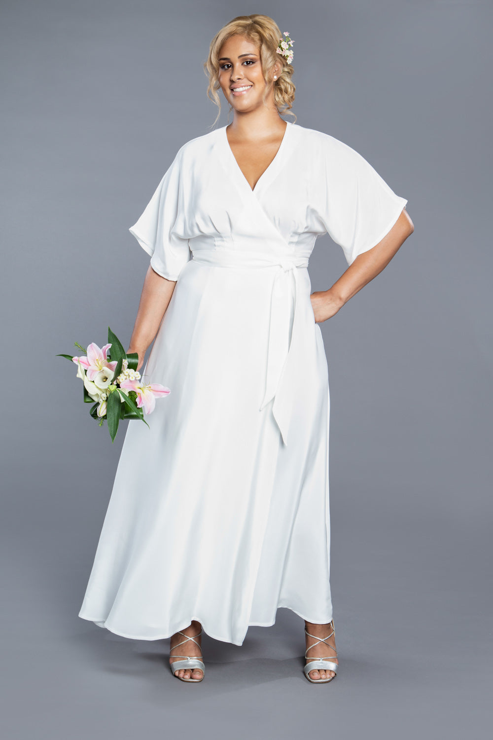 White wedding style wrap dress sewn from the Closet Core Elodie Wrap Dress PDF sewing pattern