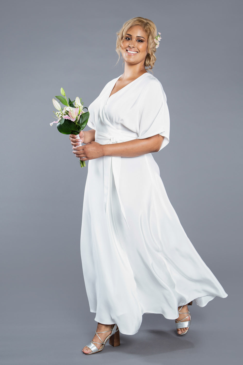 White maxi wrap dress with bouquet, made with the Closet Core Elodie Wrap Dress PDF sewing pattern