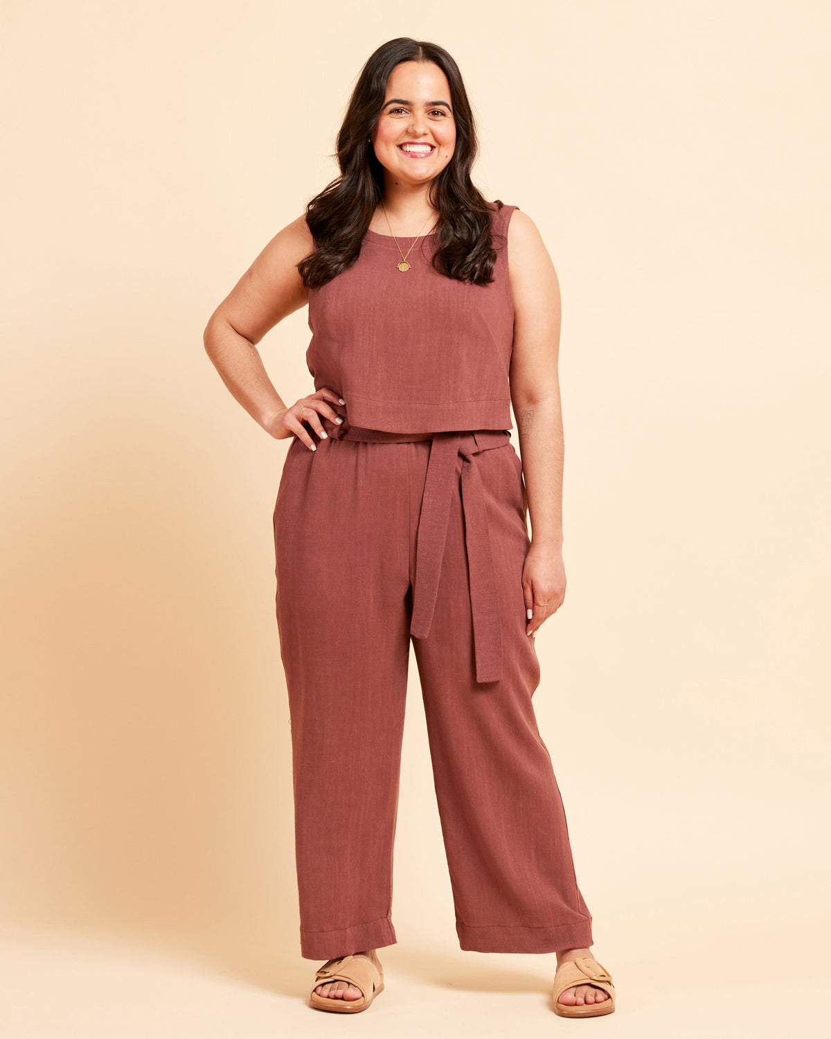 Cashmerette Everett Pants and Shorts PDF sewing pattern, woman wearing a brown top and brown pants in front of a yellow background