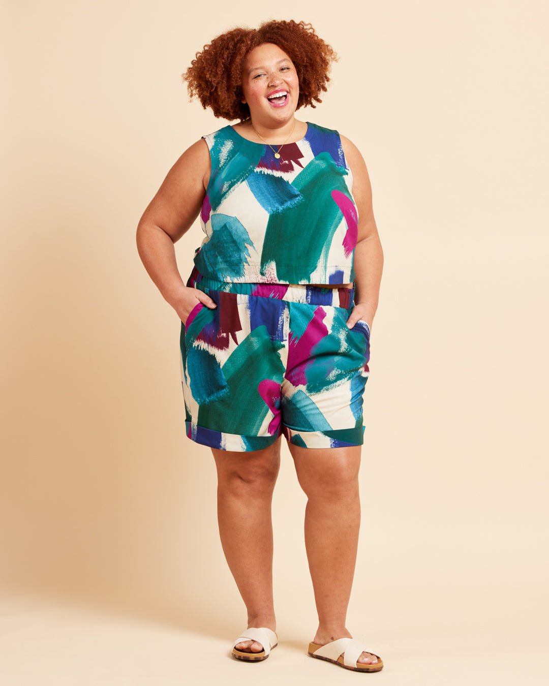 Cashmerette Everett Pants and Shorts PDF sewing pattern, woman wearing a colorful sleeveless top and shorts set, front view