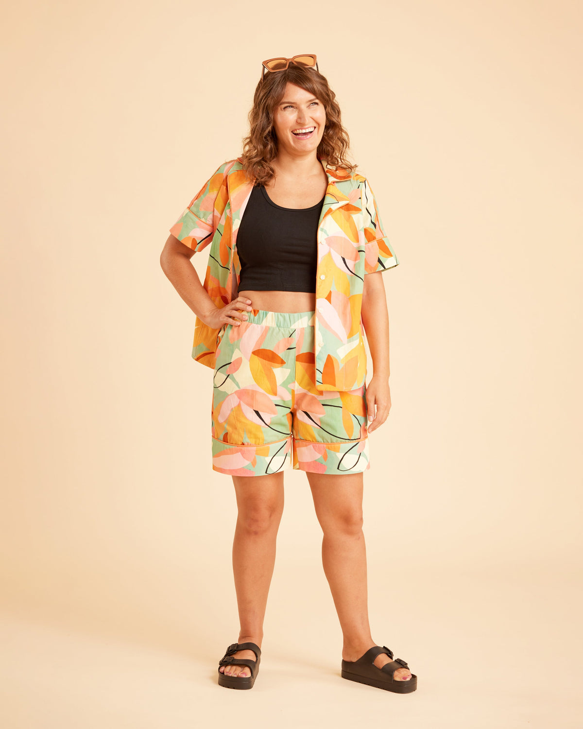 Cashmerette Fiske Sleepwear Set PDF sewing pattern, woman wearing a colorful outfit with a patterned jacket and shorts