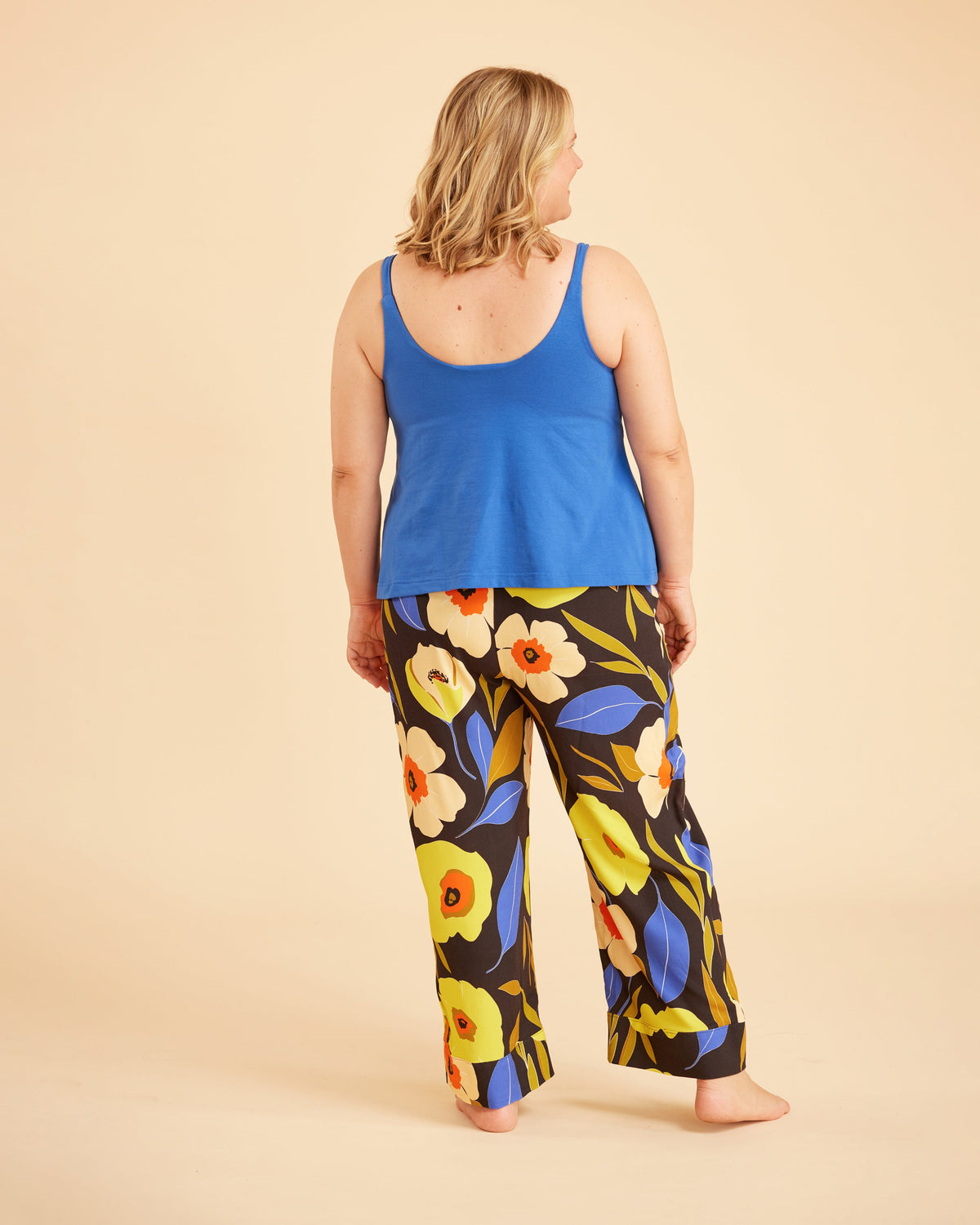 Cashmerette Fiske Sleepwear Set PDF sewing pattern, woman wearing a blue tank top and colorful floral pants
