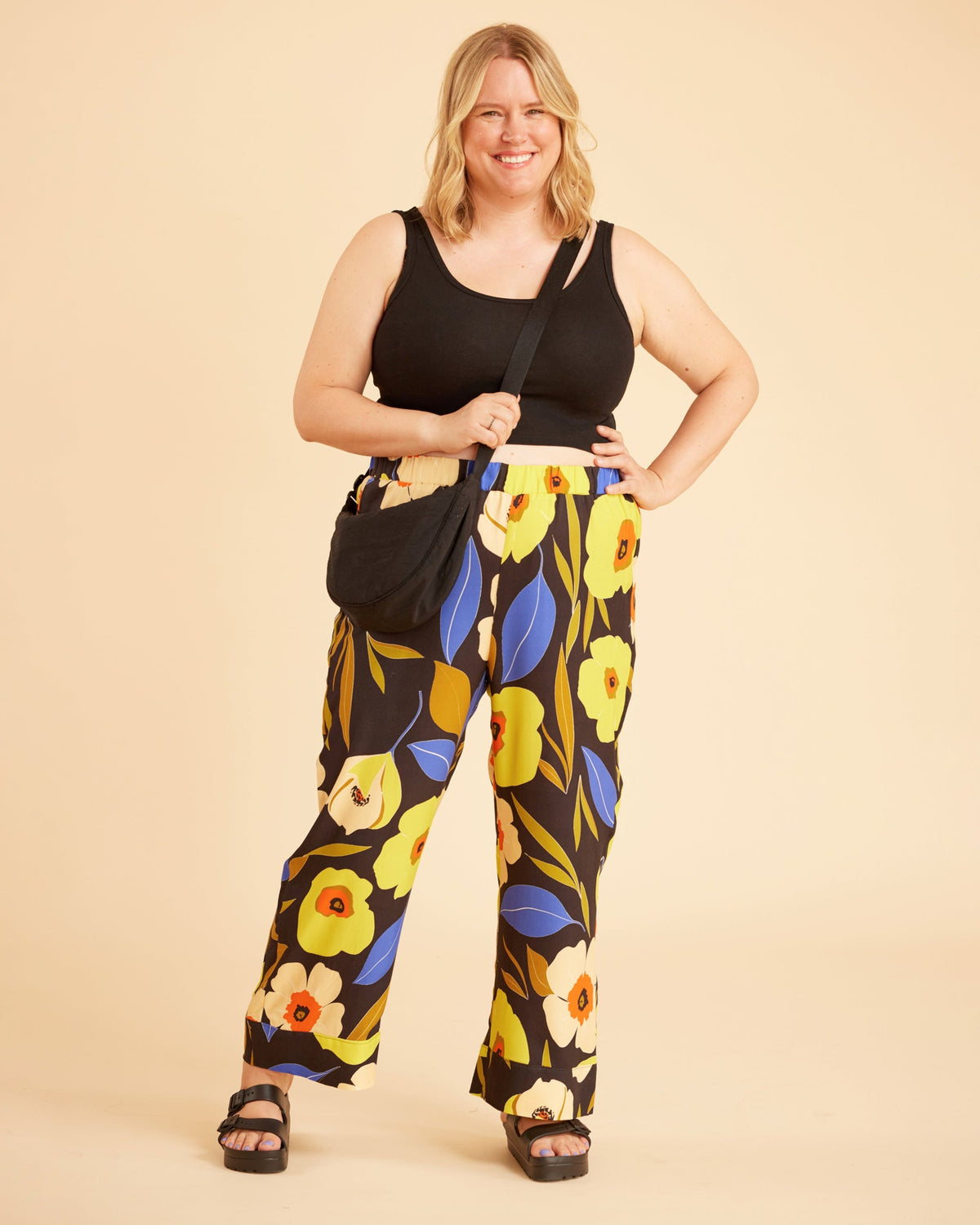 Cashmerette Fiske Sleepwear Set PDF sewing pattern, woman wearing a black tank top and floral pants