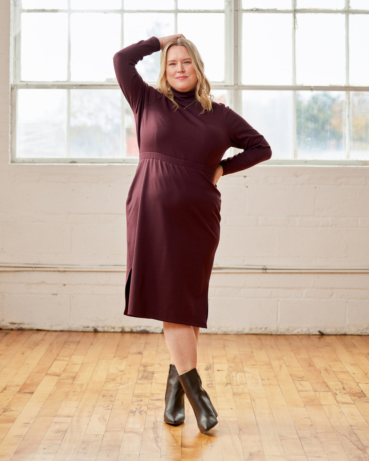 Cashmerette Grafton Dress, Top and Skirt PDF sewing pattern, woman wearing a burgundy dress standing in a room with large windows and wooden floor