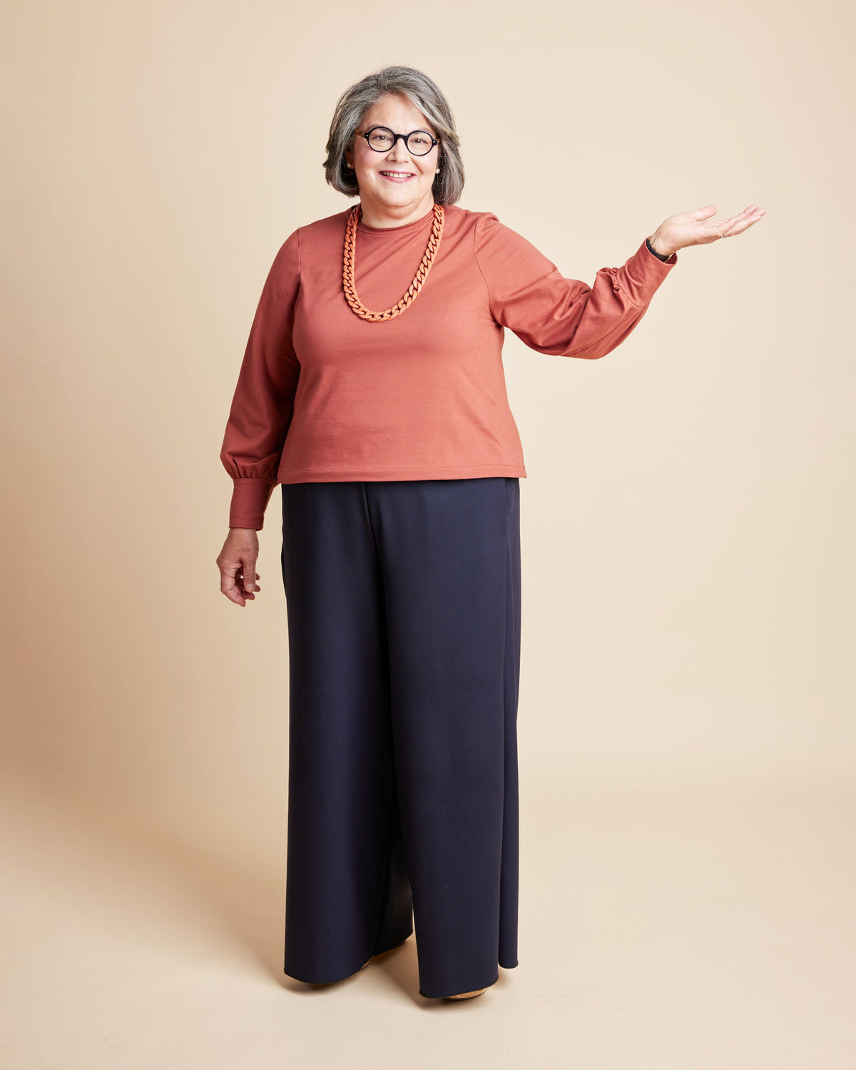 Cashmerette Grafton Dress, Top and Skirt PDF sewing pattern, woman wearing a rust-colored sweater and navy pants
