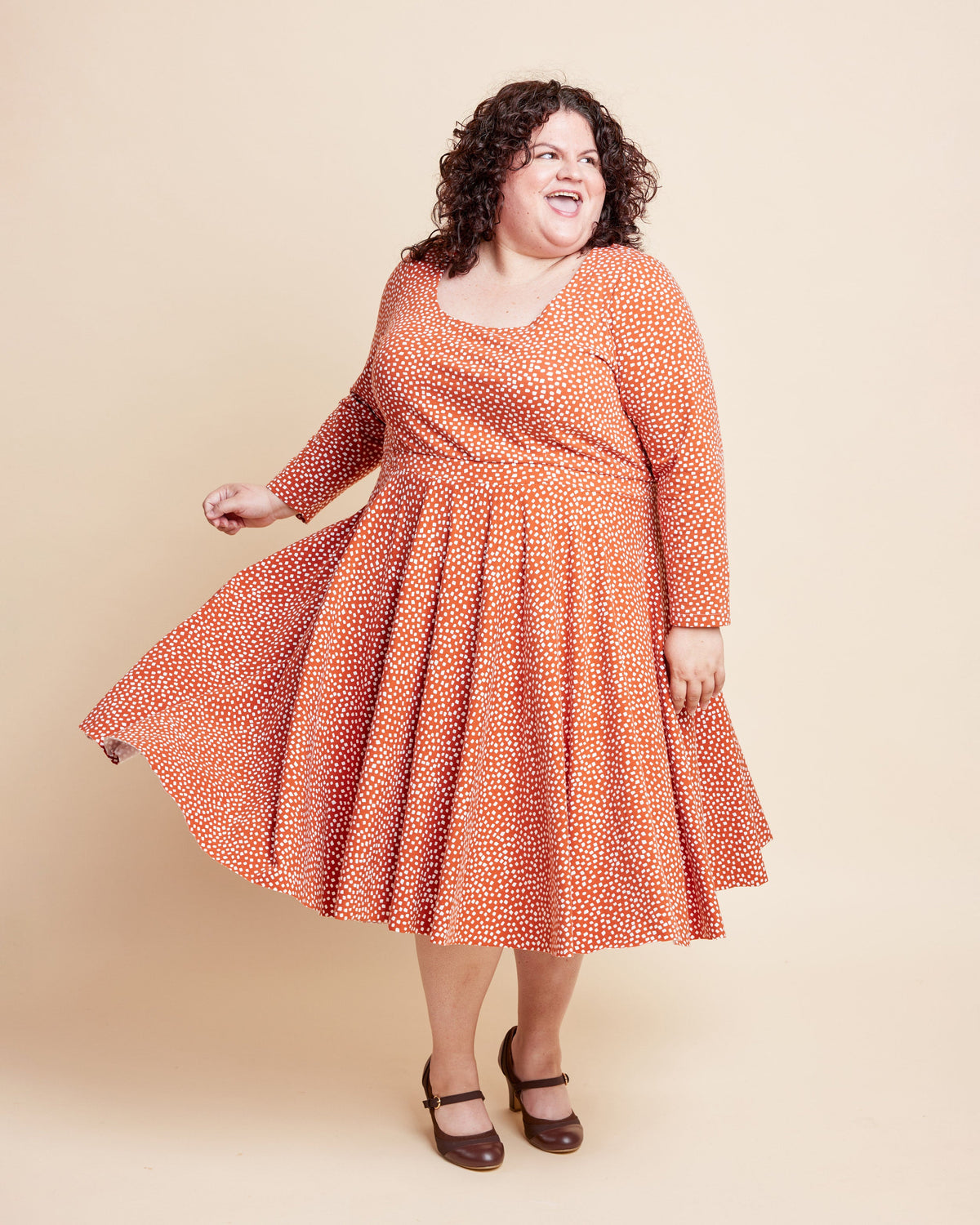 Cashmerette Grafton Dress, Top and Skirt PDF sewing pattern, woman wearing an orange patterned dress, coral version