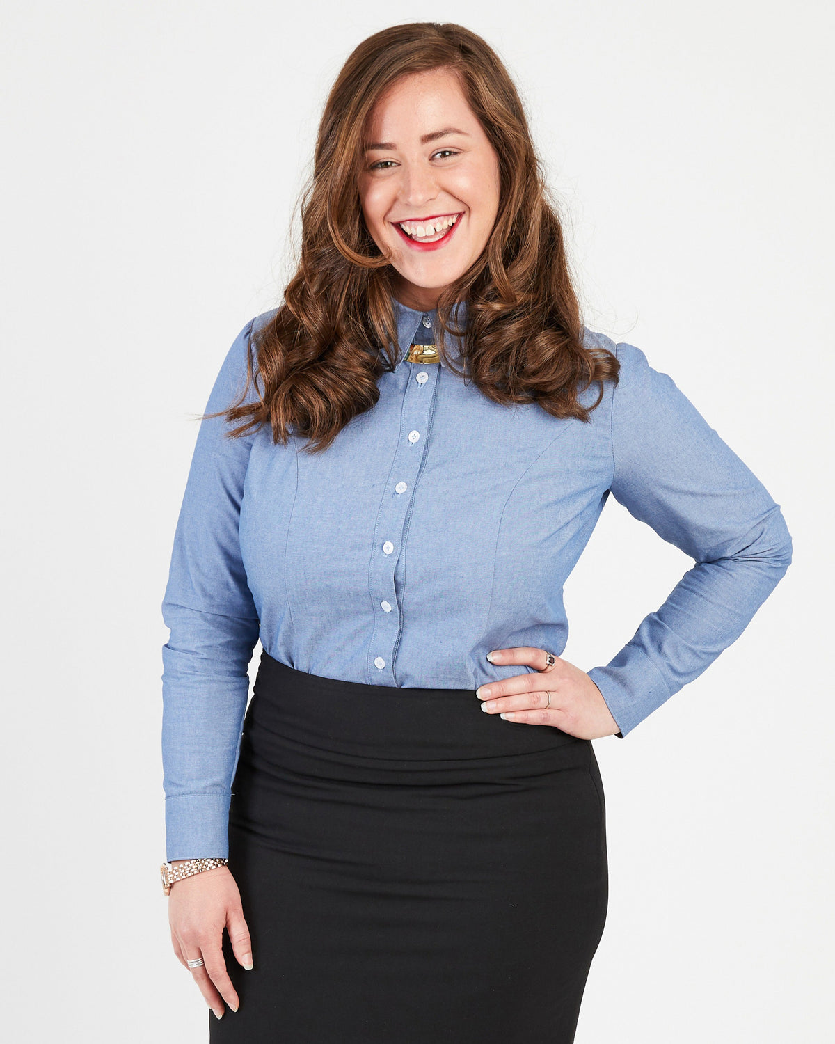 Cashmerette Harrison Shirt PDF sewing pattern, woman wearing a blue button-up shirt and black skirt