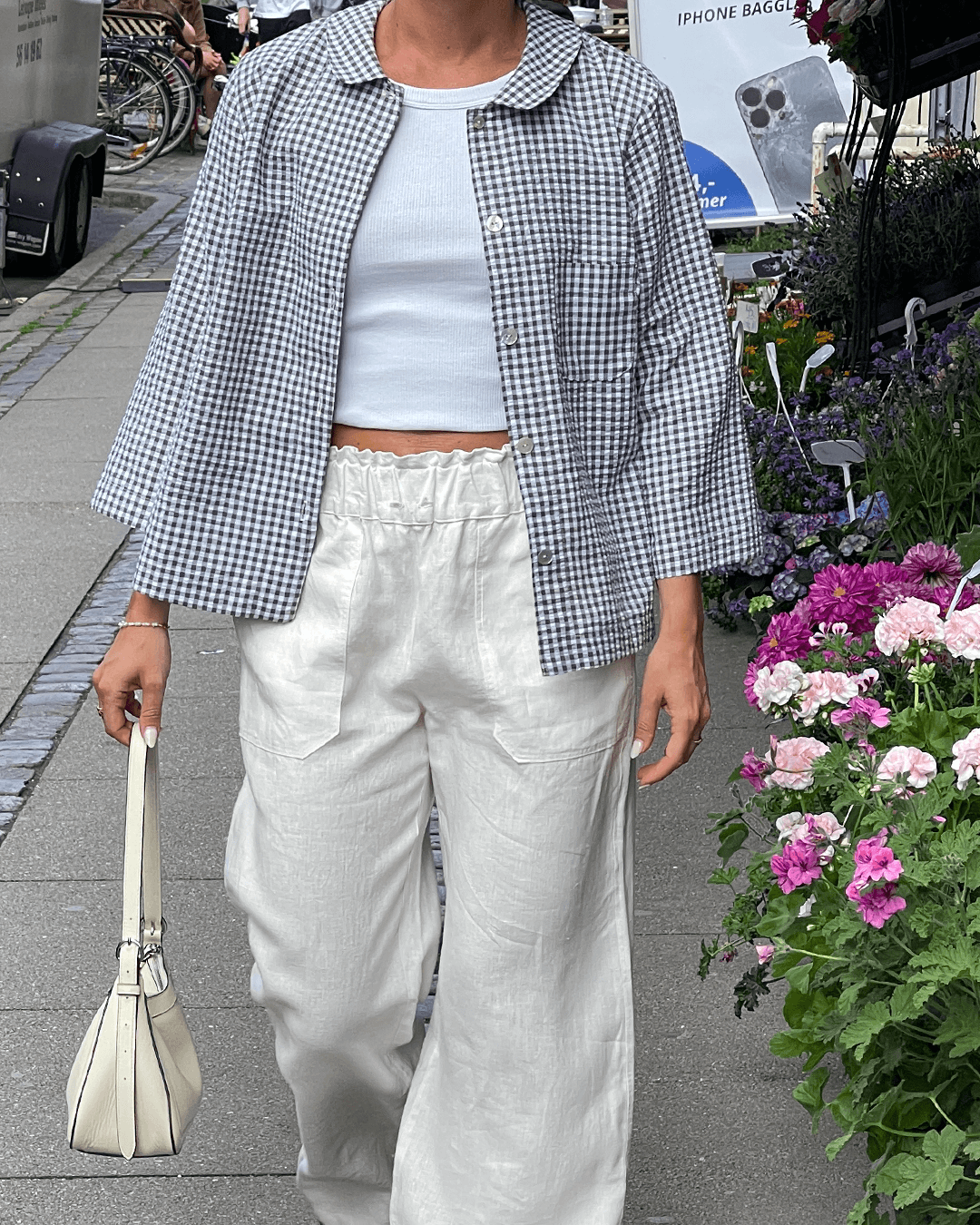 Wardrobe By Me High Waist Pants PDF sewing pattern, model in white pants seated