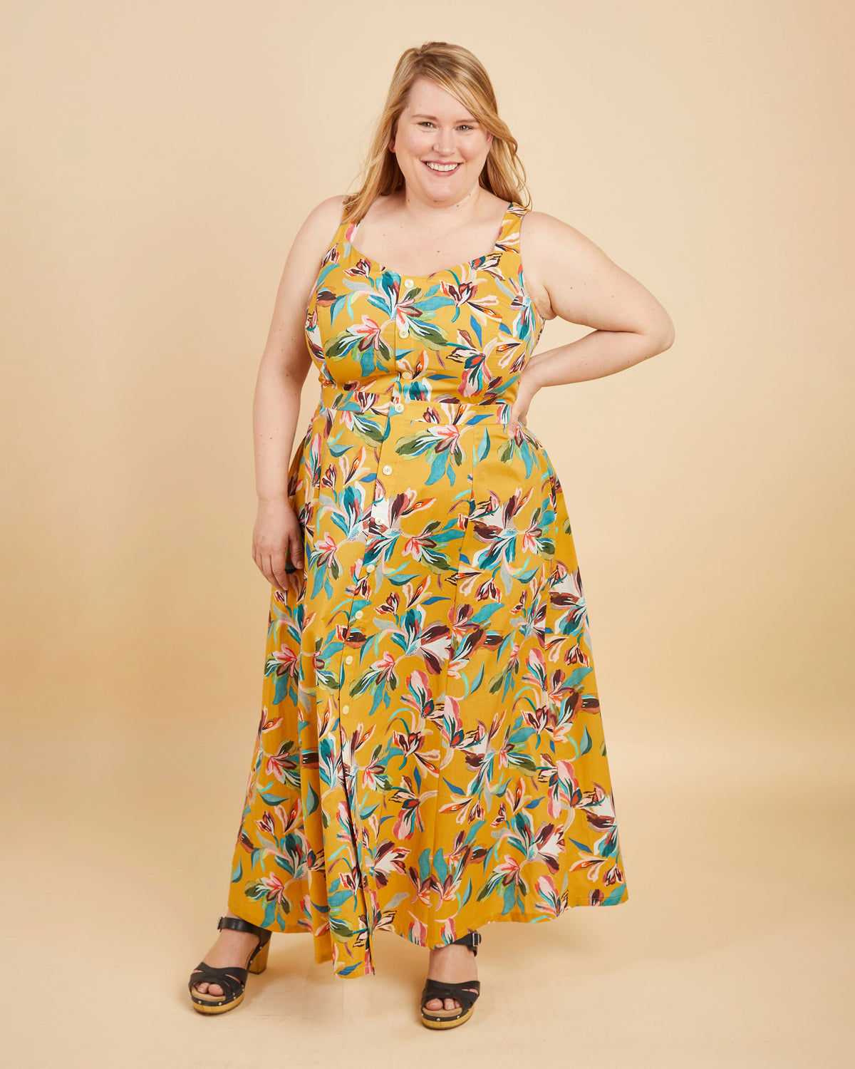 Cashmerette Holyoke Maxi Dress and Skirt PDF sewing pattern, woman wearing a yellow floral dress, full length side view