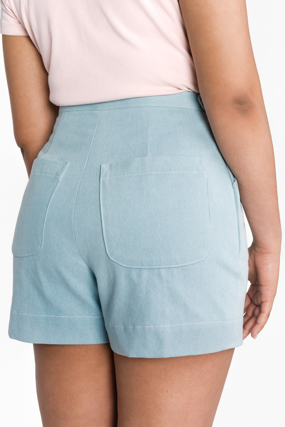 Back view of blue shorts made with the Closet Core Jenny Overalls and trousers PDF sewing pattern