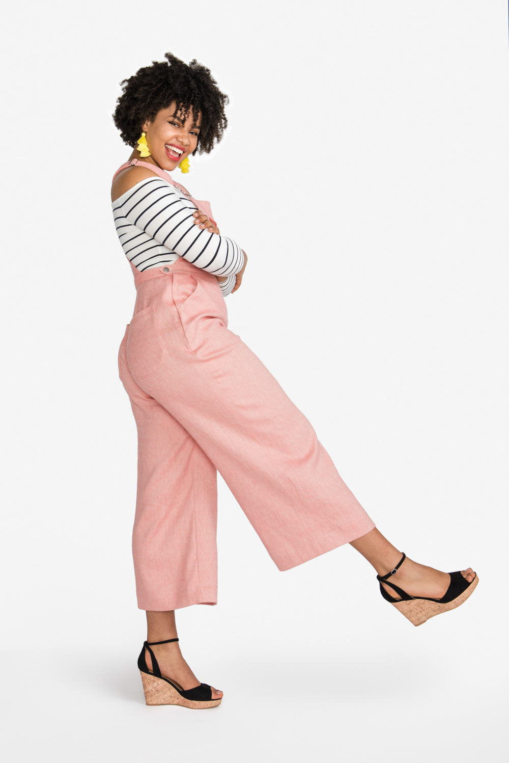 Pink cropped overalls from the Closet Core Jenny Overalls and trousers PDF sewing pattern, side kick pose
