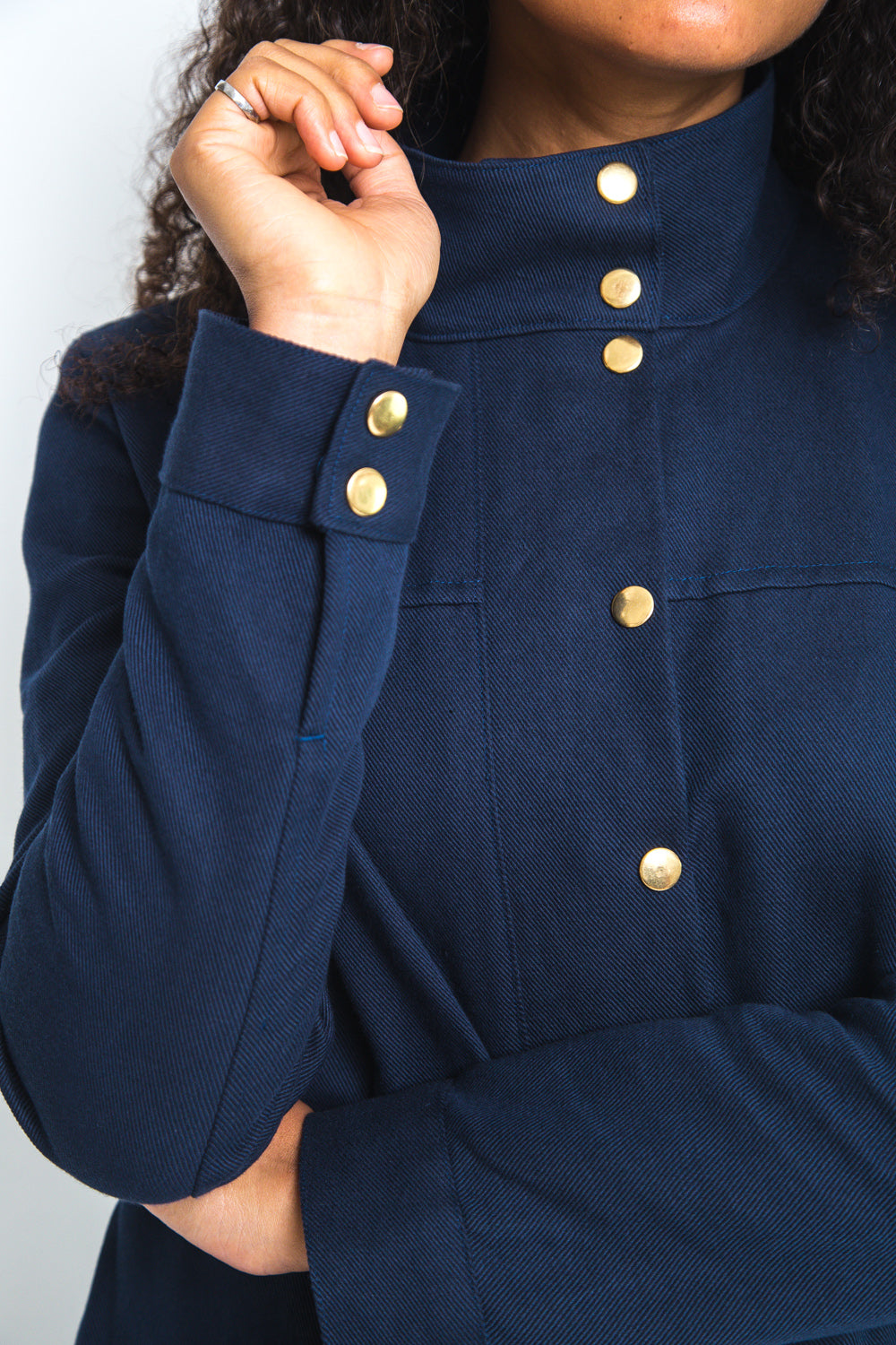 Close-up of the collar and snaps on a navy anorak, Closet Core Kelly Anorak PDF sewing pattern