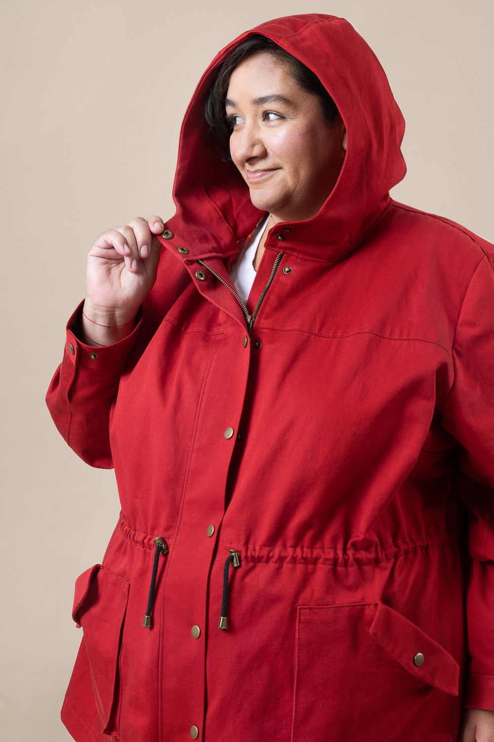 Red anorak with the hood up, sewn from the Closet Core Kelly Anorak PDF sewing pattern