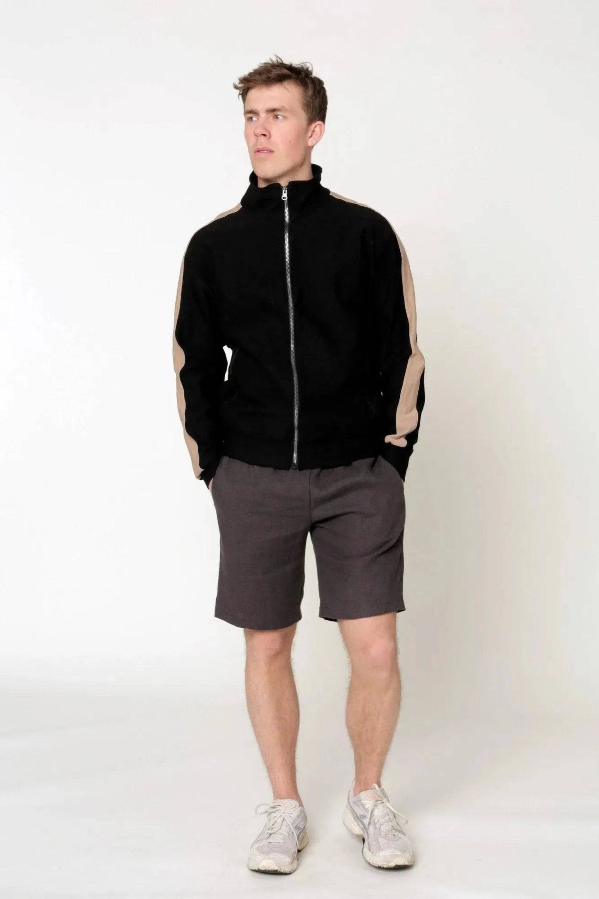 Wardrobe By Me Loose Linen Pants PDF sewing pattern, model in a print shirt and shorts