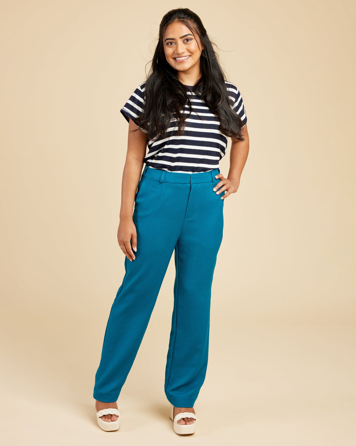 Cashmerette Meriam Trousers PDF sewing pattern, woman wearing a black and white striped shirt with blue pants