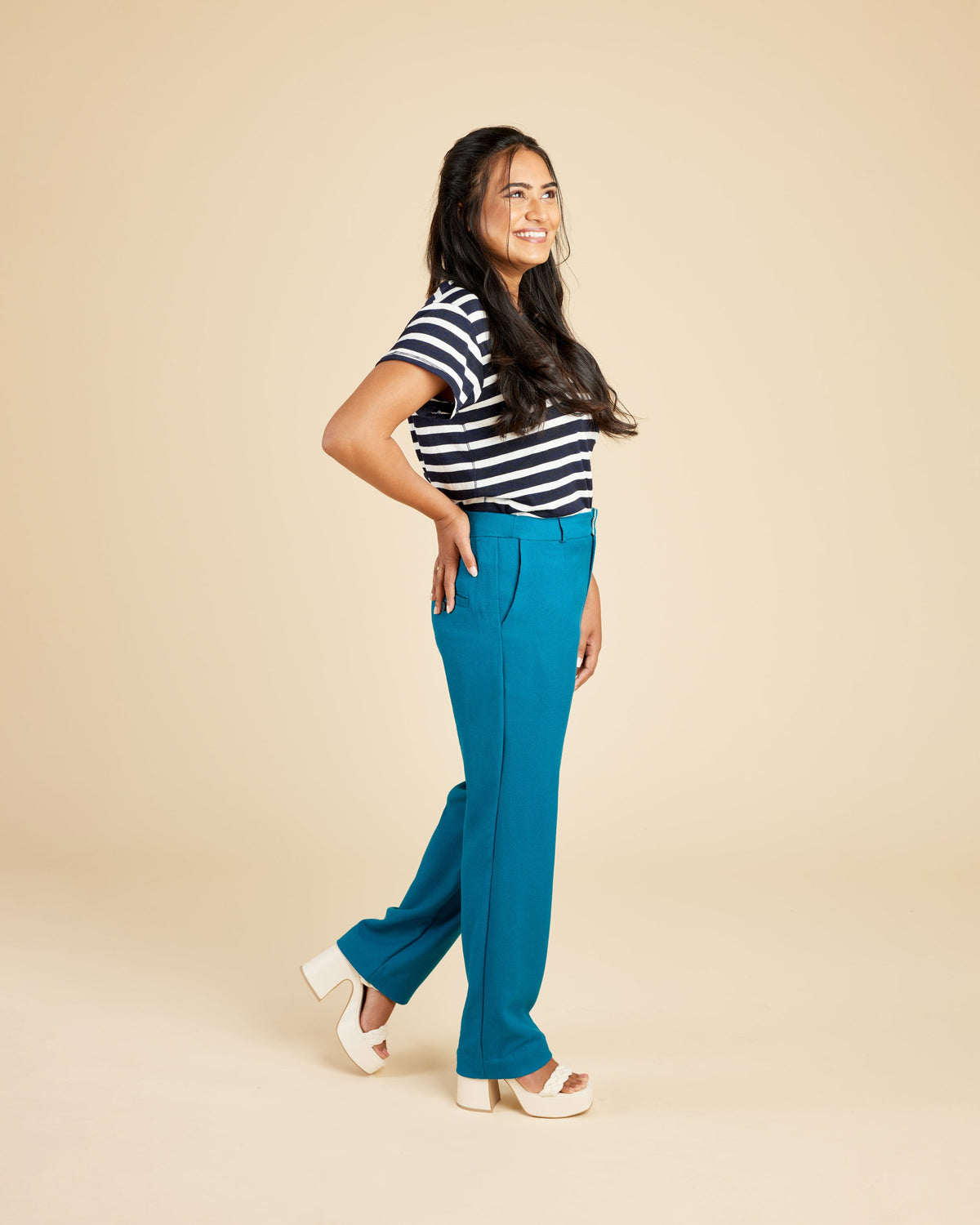 Cashmerette Meriam Trousers PDF sewing pattern, woman wearing a black and white striped shirt and blue pants