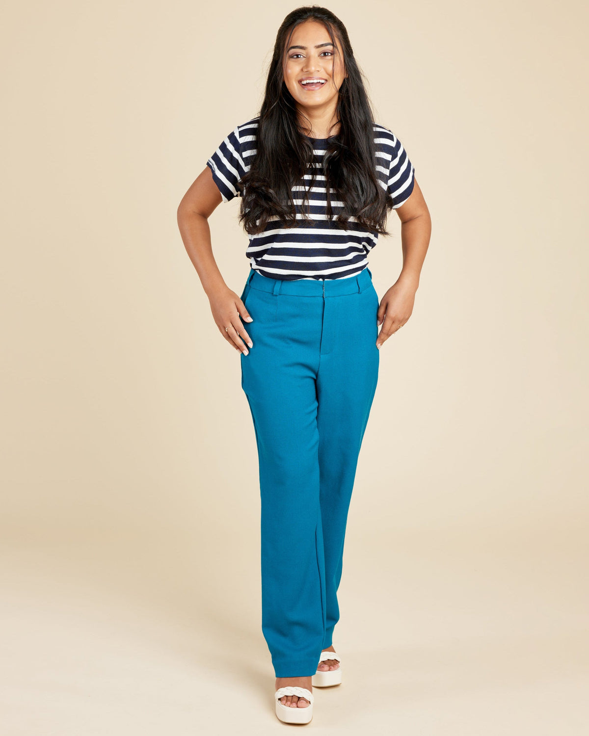 Cashmerette Meriam Trousers PDF sewing pattern, woman wearing a striped shirt and blue pants