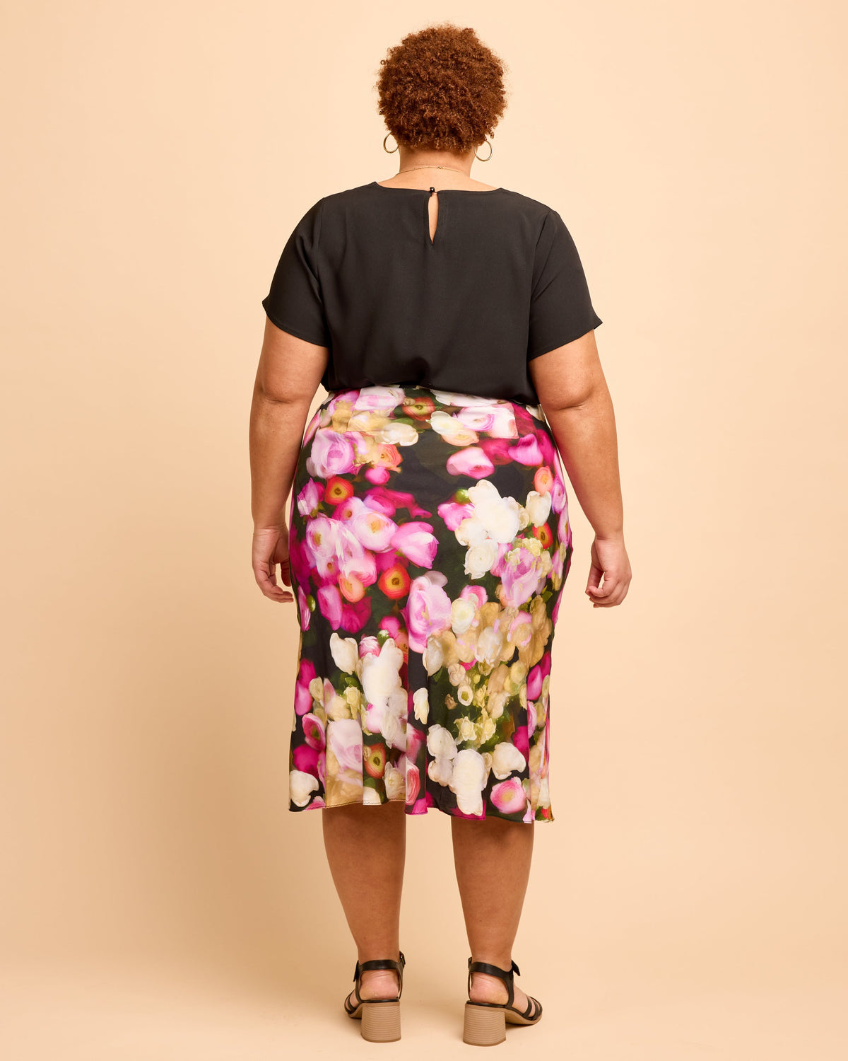Cashmerette Montrose Top PDF sewing pattern, person wearing a black top and floral skirt