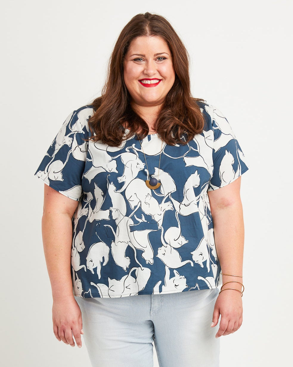 Cashmerette Montrose Top PDF sewing pattern, woman wearing a blue floral blouse and light blue jeans