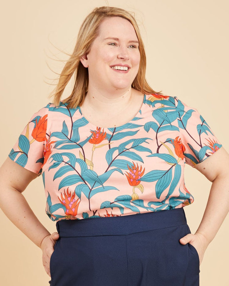 Cashmerette Montrose Top PDF sewing pattern, woman wearing a colorful floral top and navy wide-leg pants