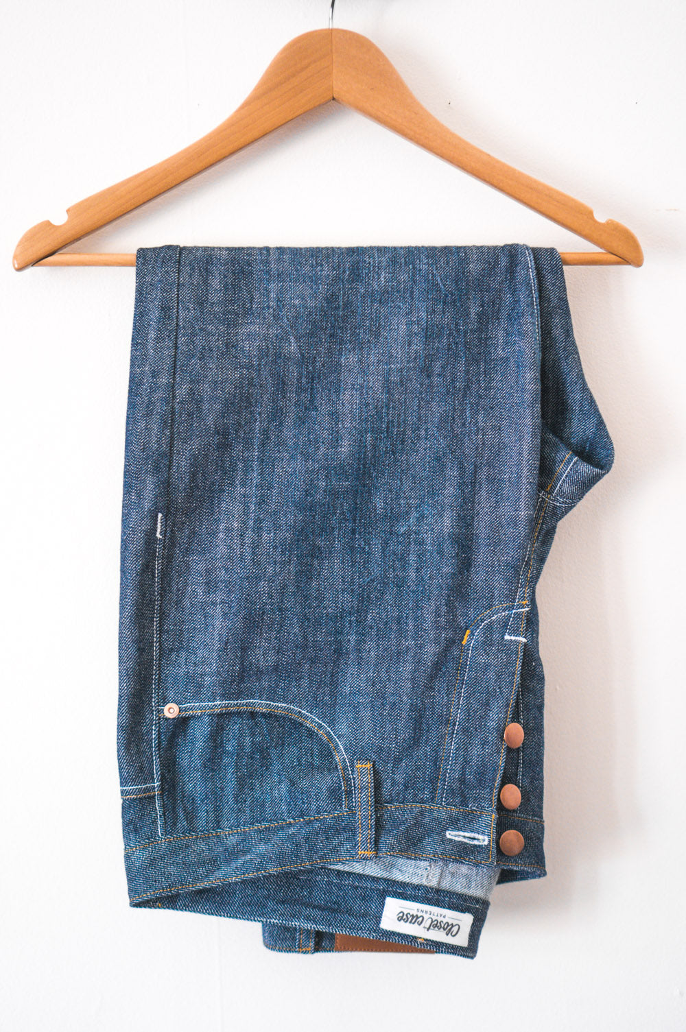 Back pocket view of jeans on a hanger, Closet Core Morgan Boyfriend Jeans PDF sewing pattern