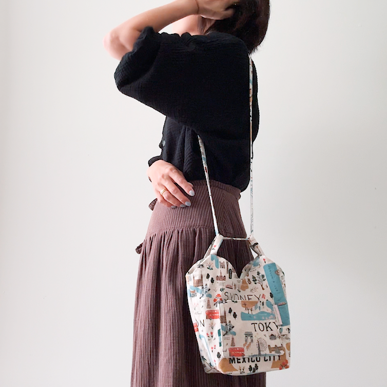 Sewing Therapy Bridge Bag PDF sewing pattern, blue bag held at the side