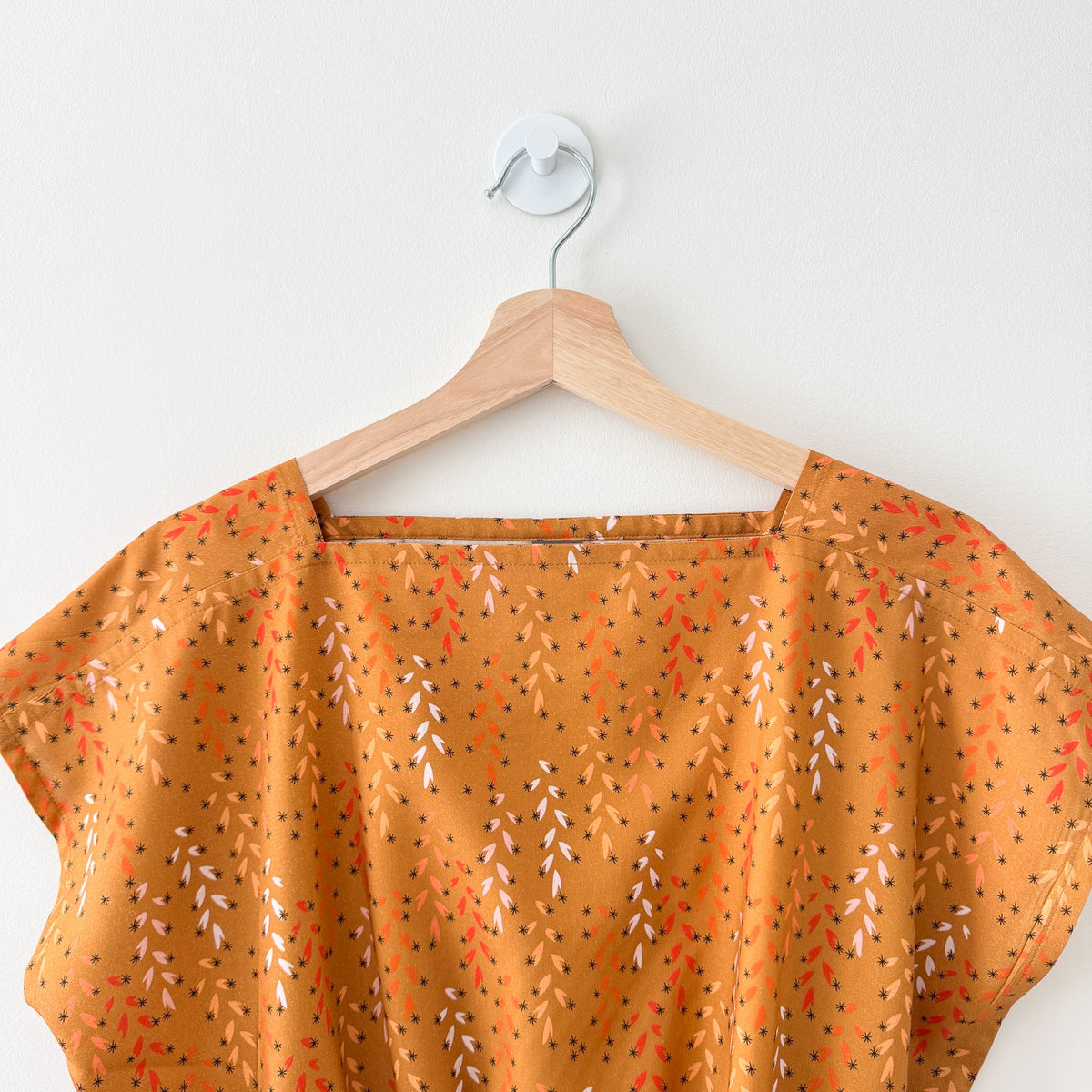 Sewing Therapy Rectangle Top PDF sewing pattern, orange top on a hanger