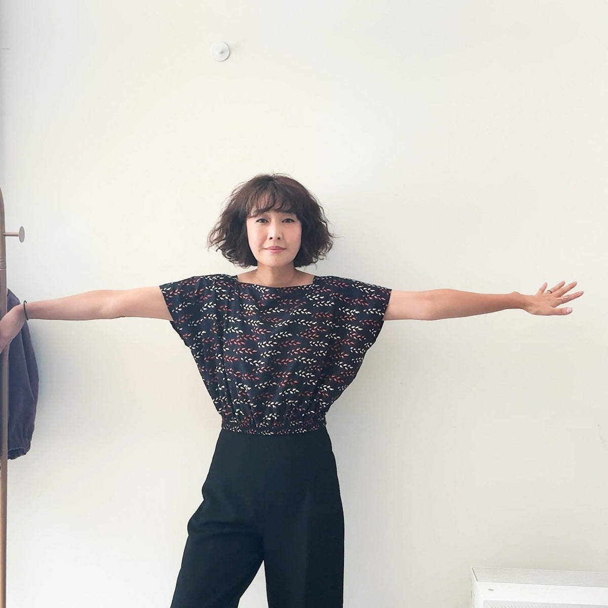Sewing Therapy Rectangle Top PDF sewing pattern, model with arms out in a dark top